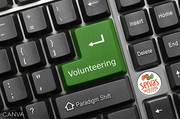 Photo of computer keyboard with the enter key labeled "Volunteering"